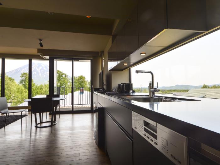 Muse Niseko - kitchen view to outside mountains kitchen view to outside mountains