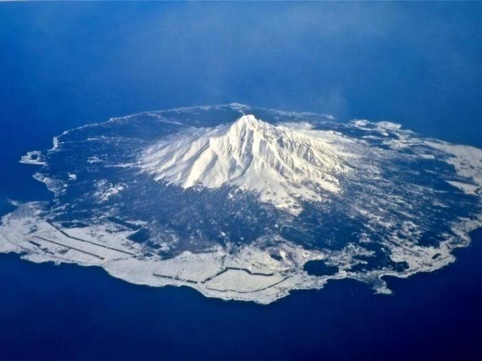 A snow covered Rishiri Island from the air