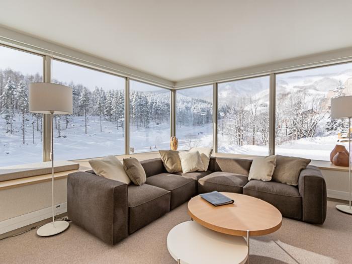 Round table and corner sofa with views to the ski resort