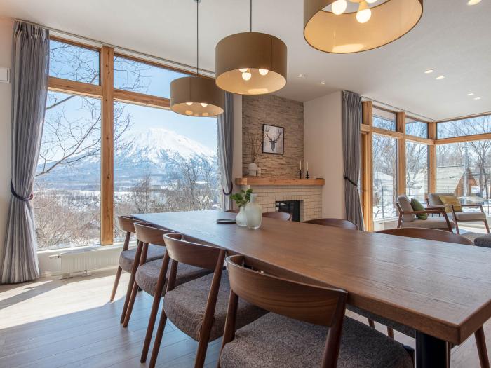 A dining table and hanging lights