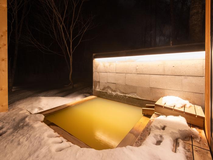 An outdoor onsen at night