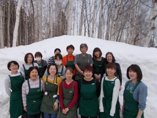 A group of 13 people pose for the Holiday Niseko cleaning team photograph