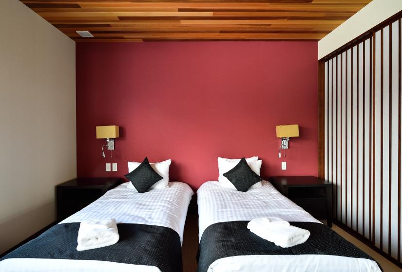 twin beds on red wall background