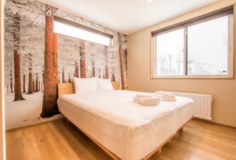 Kabayama Townhouse - 4 bedroom Townhouses bedroom with wintery forest wallpaper