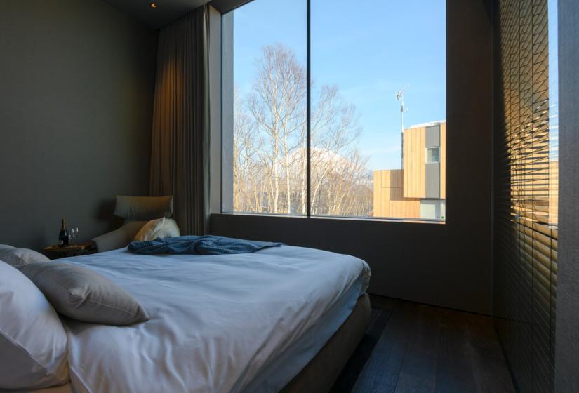 double bed with large window views
