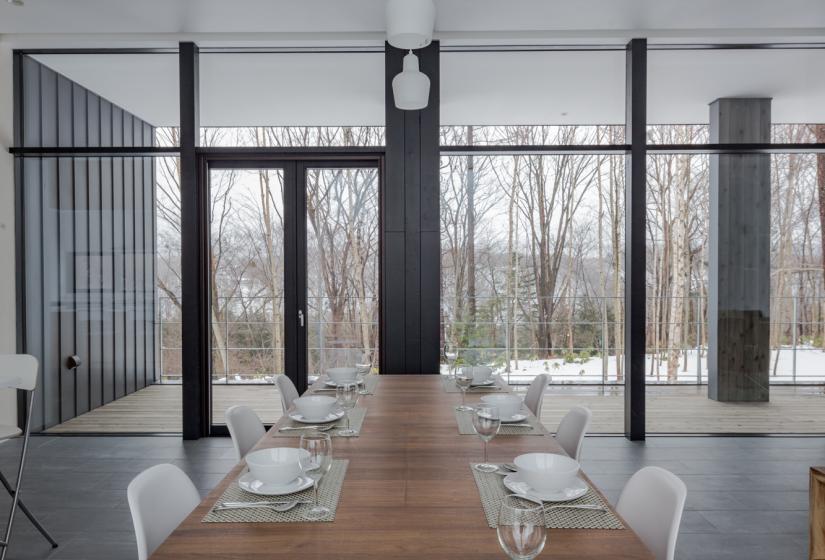 dining table with large windows and porch