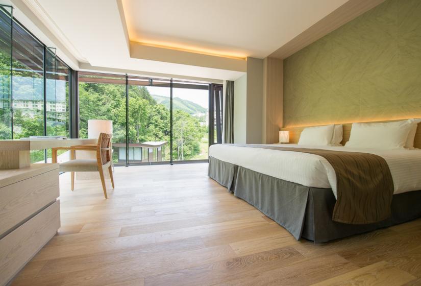 wooden floor bedroom with trees outside