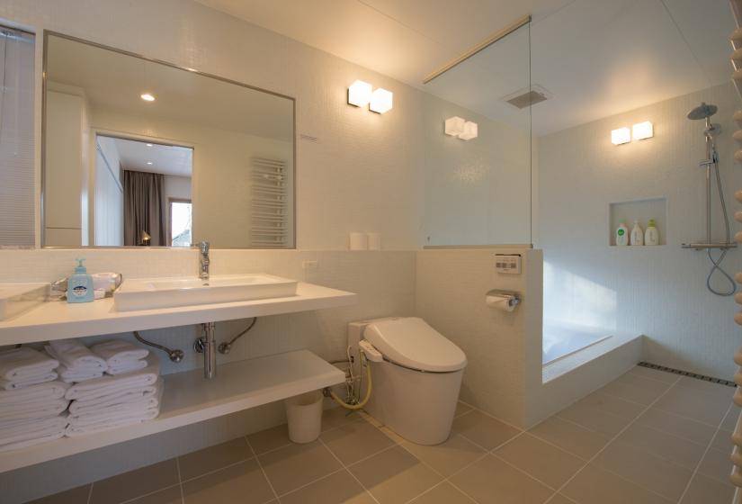 bathroom with a tub and shower