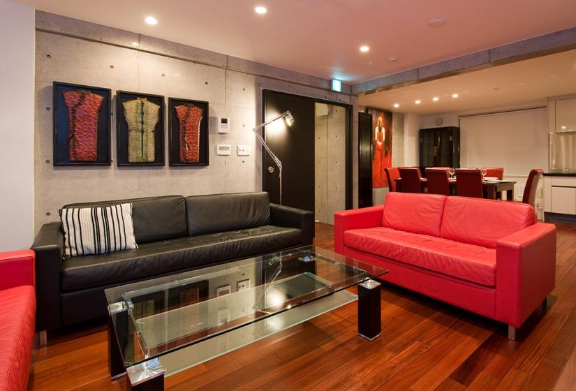 Lounge area with red and black sofas