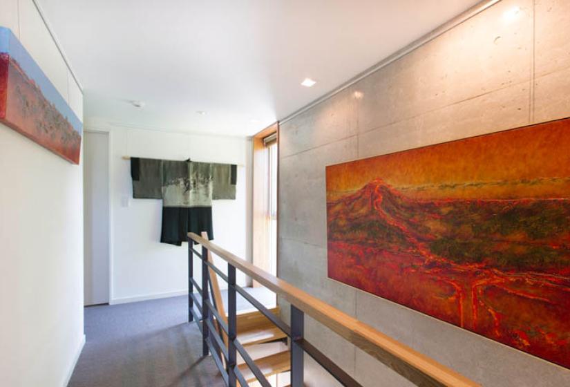 second floor railing with large red painting
