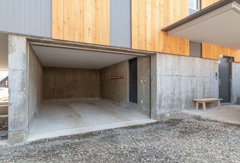 garage space with gravel driveway