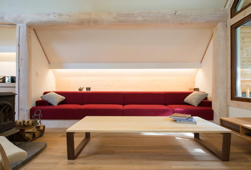Red built in sofa with coffee table