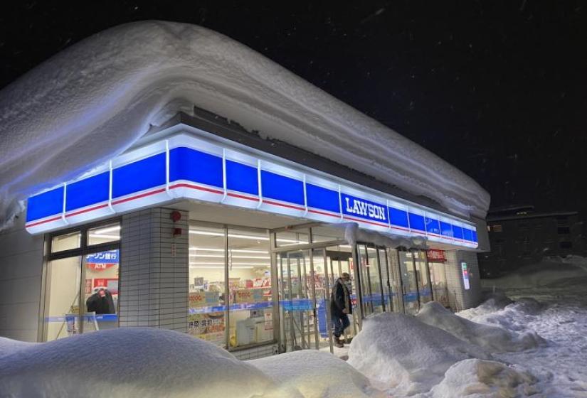 The Lawson Lawson convenience store blanketed in snow.