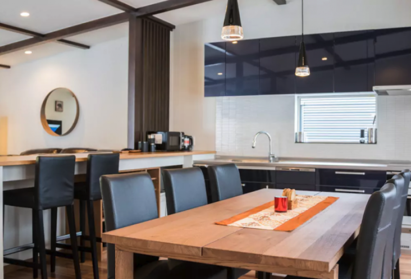 Wooden dining table with black chairs