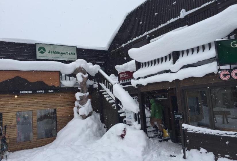 The snow covered stairway to Holiday Niseko&#039;s offivce.