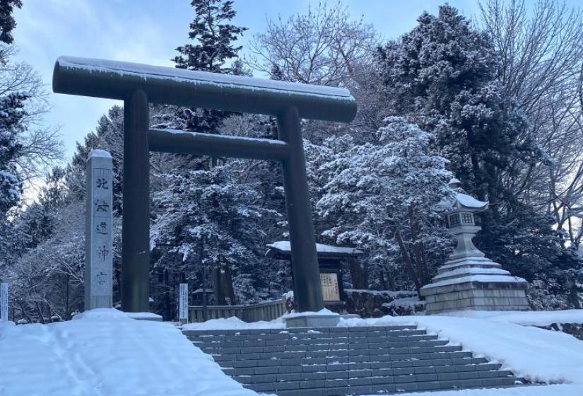 Entrance to Hokkaido Jingu Large Japanese tori gates in a snowy back drop