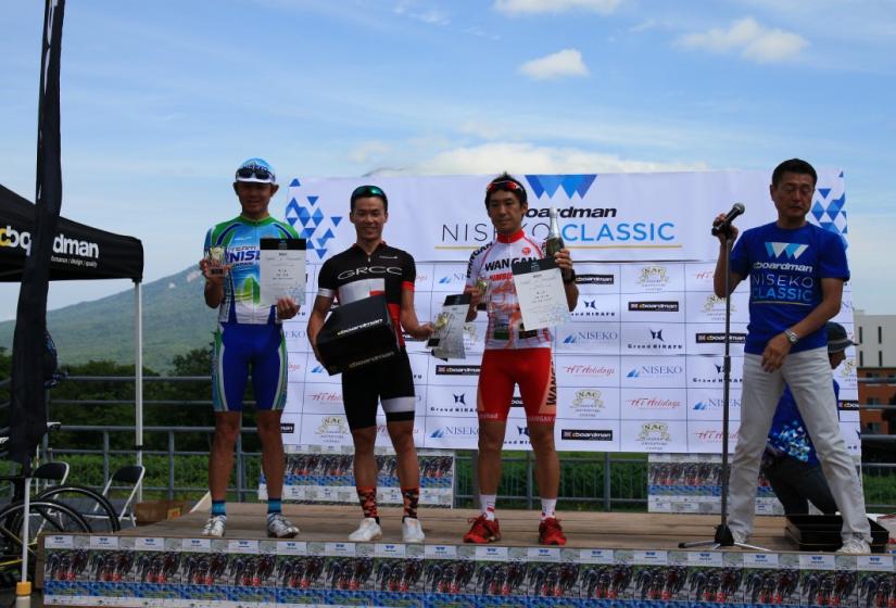 Winning cyclists on the podium.