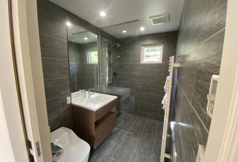 A grey tiled bathroom