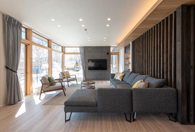 A lounge and television behind