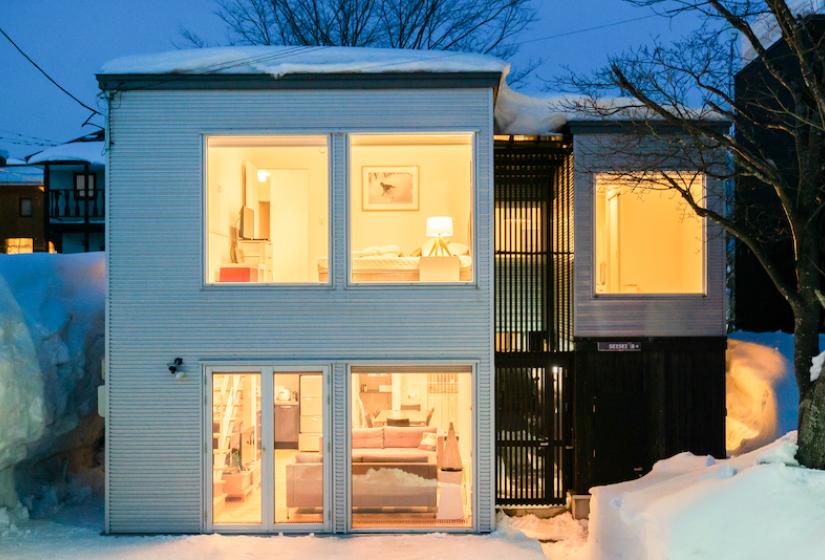 The exterior of a 2 story house at night