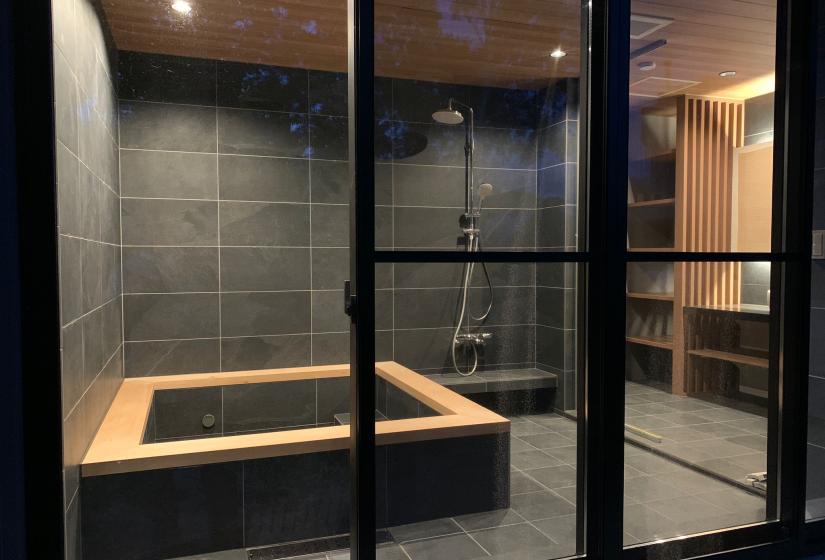 Tiled bathroom with large tub