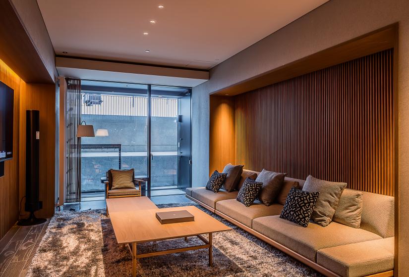 Lounge room with coffee table and steps to the ski field