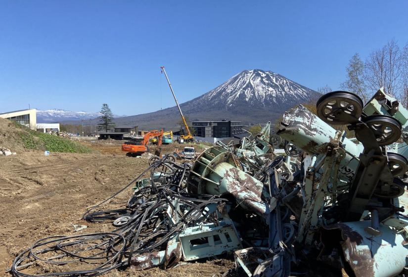 Center 4 remains A pile of scrap metal with Mount Yotei in the back ground
