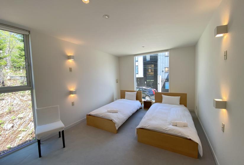 Two made up double beds