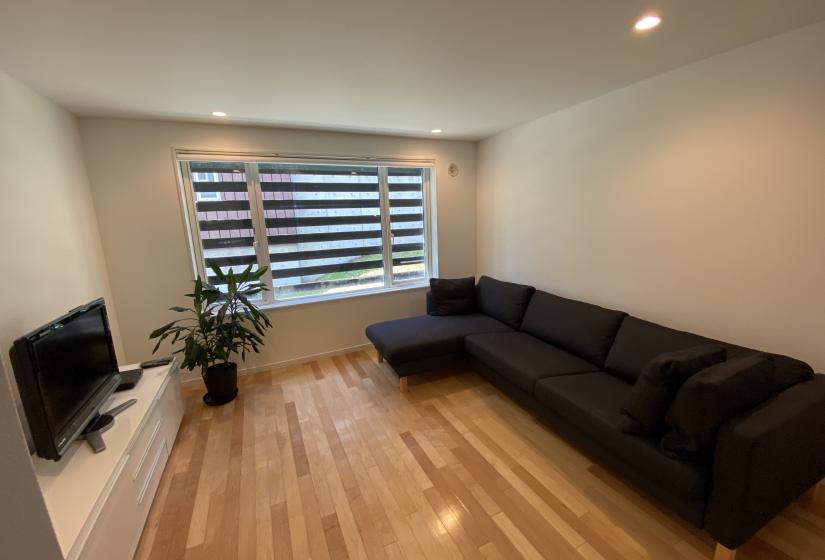A room with TV and couch