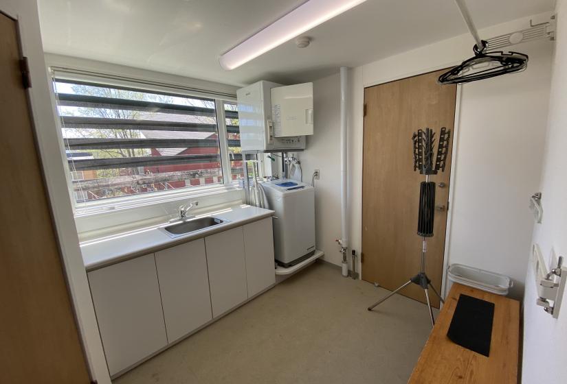 A laundry with bench and sink