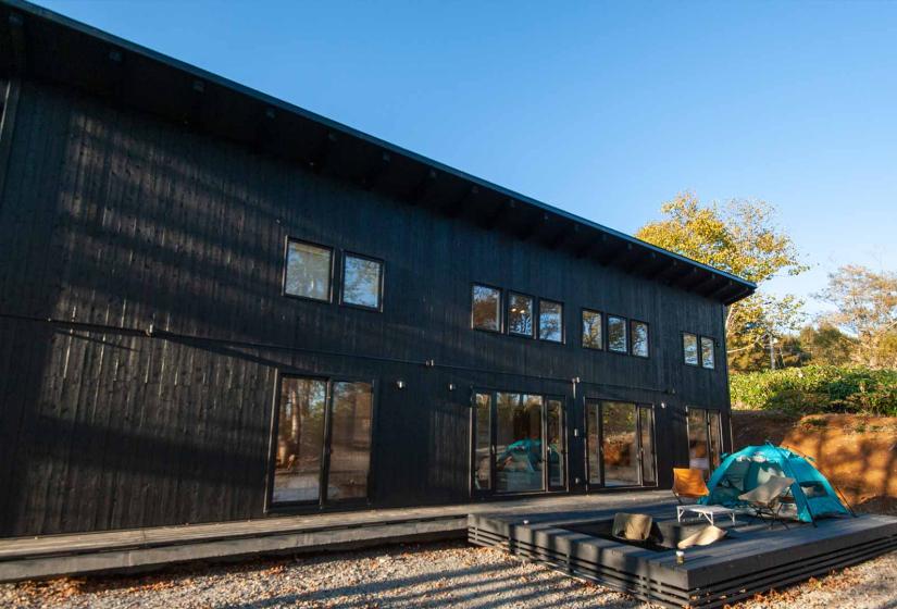 Exterior of a large dark coloured house