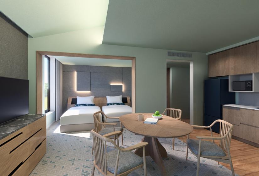A dining table and bed behind