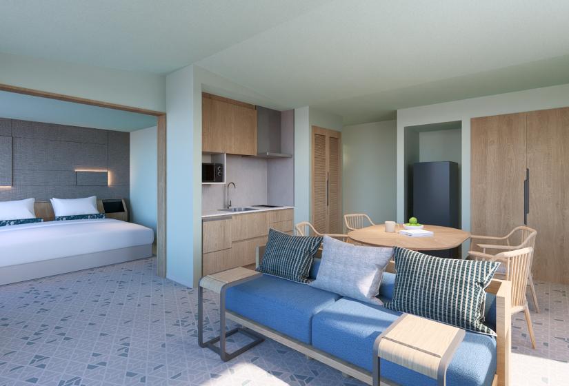 a blue couch and bed to the left