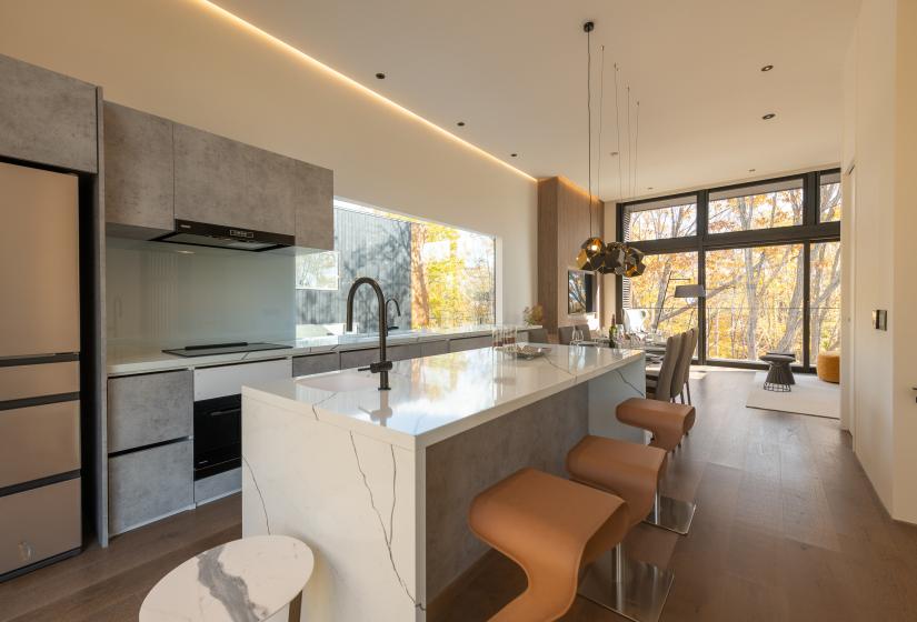 A breakfast bar with orange stools