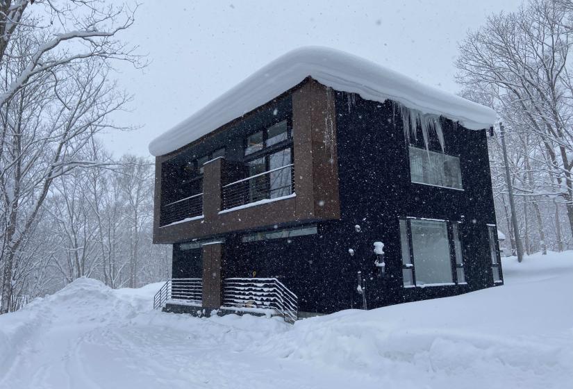 The exterior of a two story building in the snow