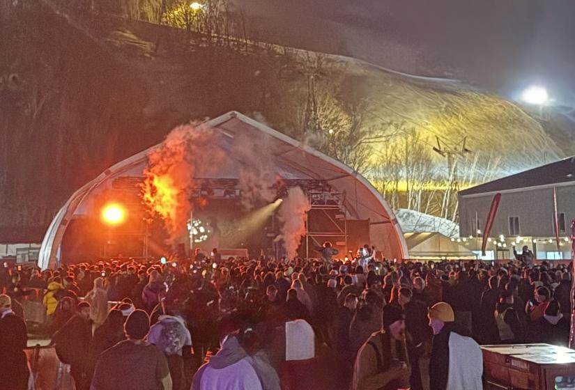 Awesome days and nights on and off the snow at Niseko's first edition of Snow Machine. A crowd in front of a stage.