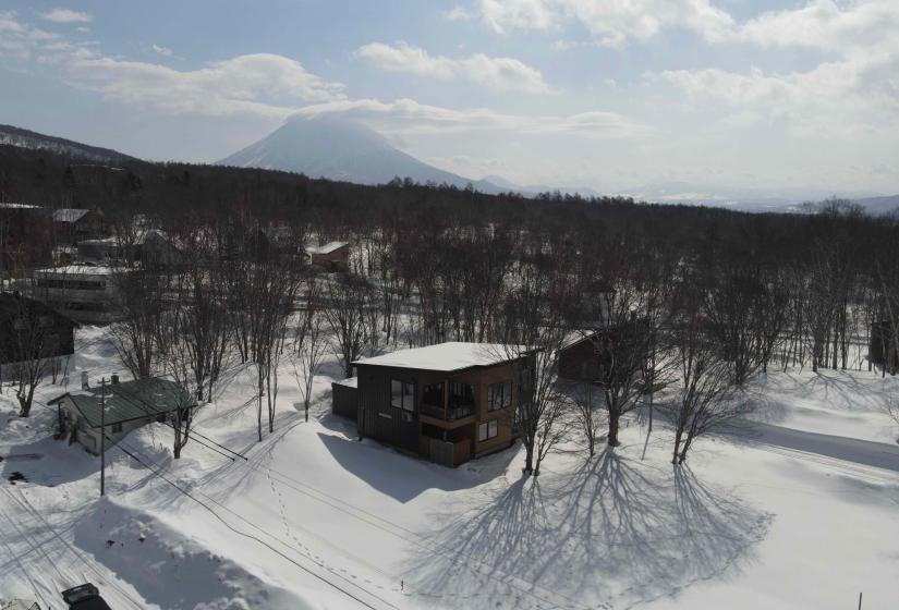 A house surrounded by snow