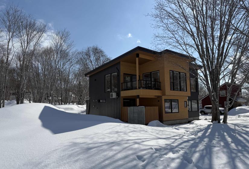 A two story house in the snow