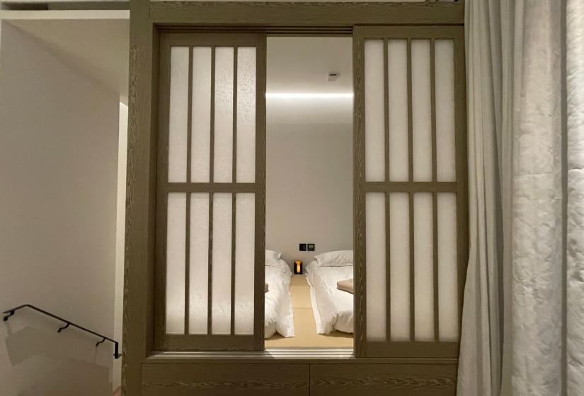 Two futons behind partially closed doors