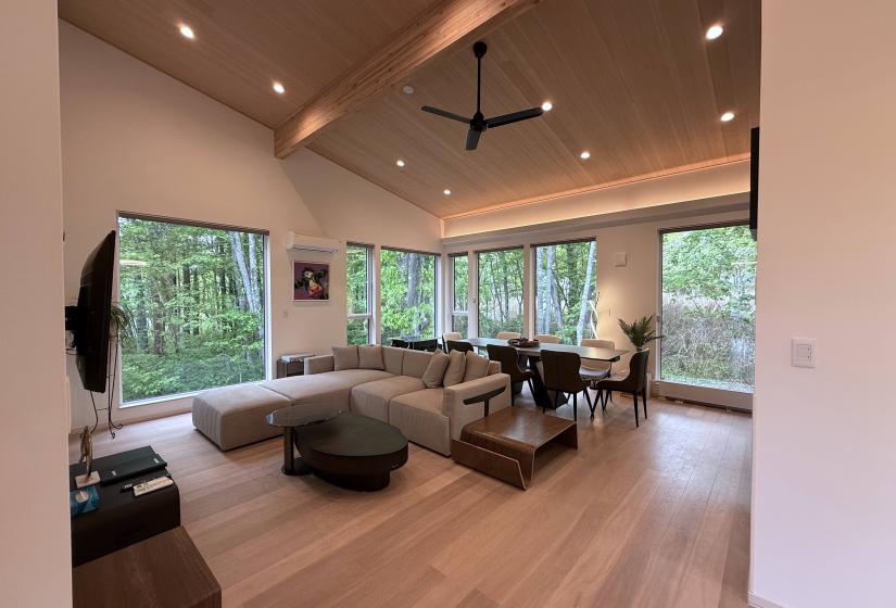 A lounge suite with table and windows behind