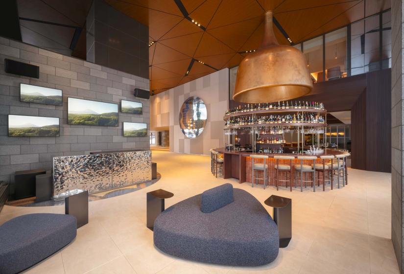 A circular bar below a giant bell