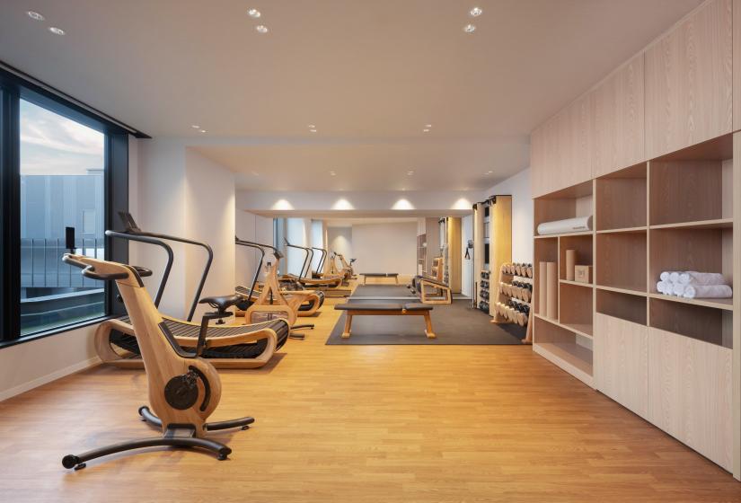 Gym equipment in a long room 