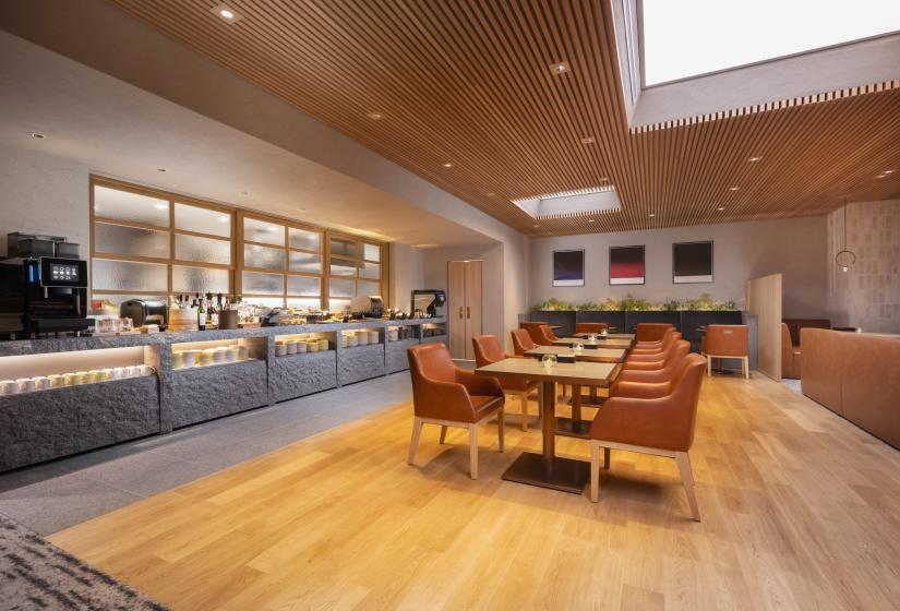 A dining table in a room with wooden floors    